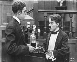 Charlie Chaplin consuming alcohol